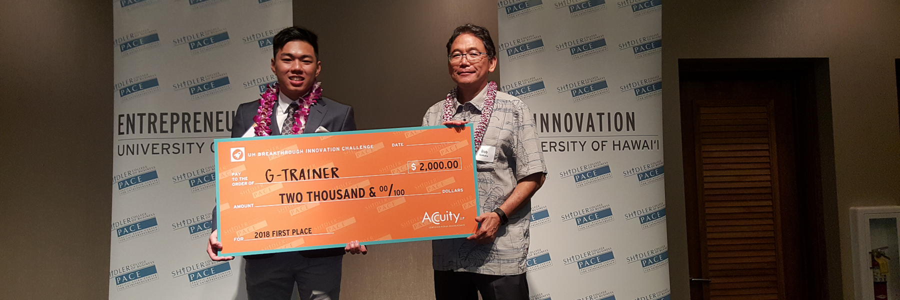 Austin Yoshino And Bob Nakata Hold A Big Check.