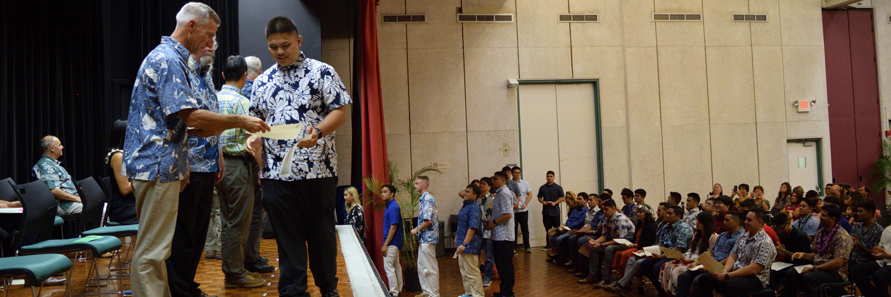 Graduates Lined Up To Receive Their Certificates.