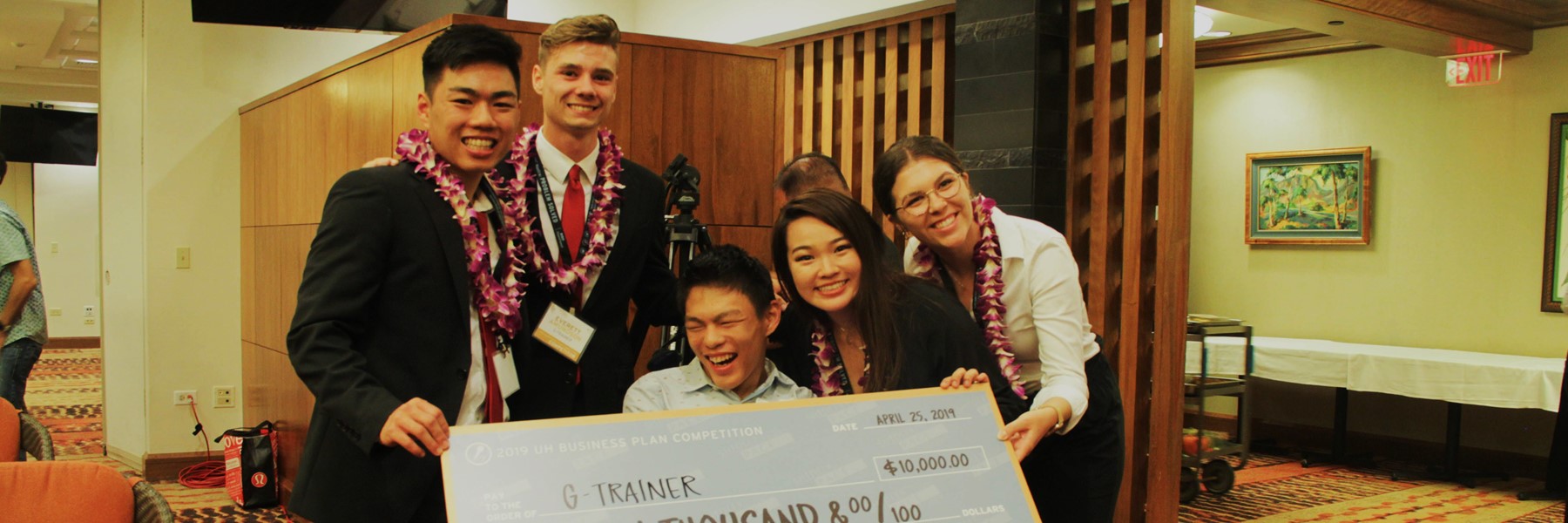 G-Trainer Team Holding A $10,000 Check.