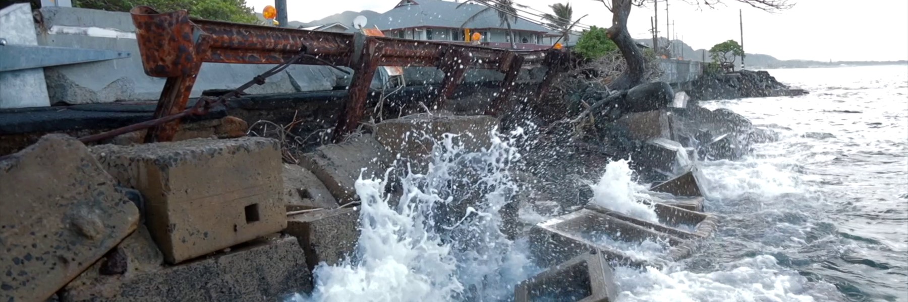 Waves Crashing Against An Eroded Road.