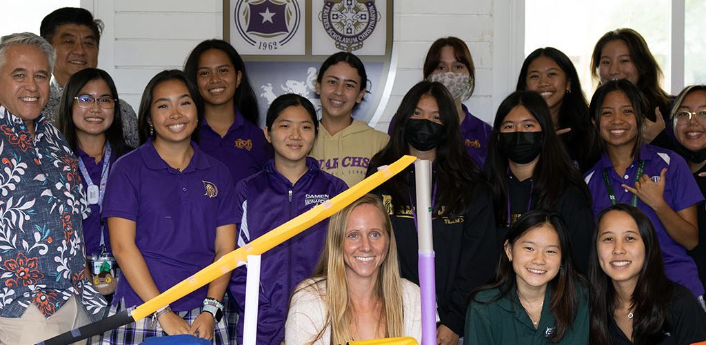 A Group Of Damien Students Posing For The Camera