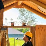 Students working on a house