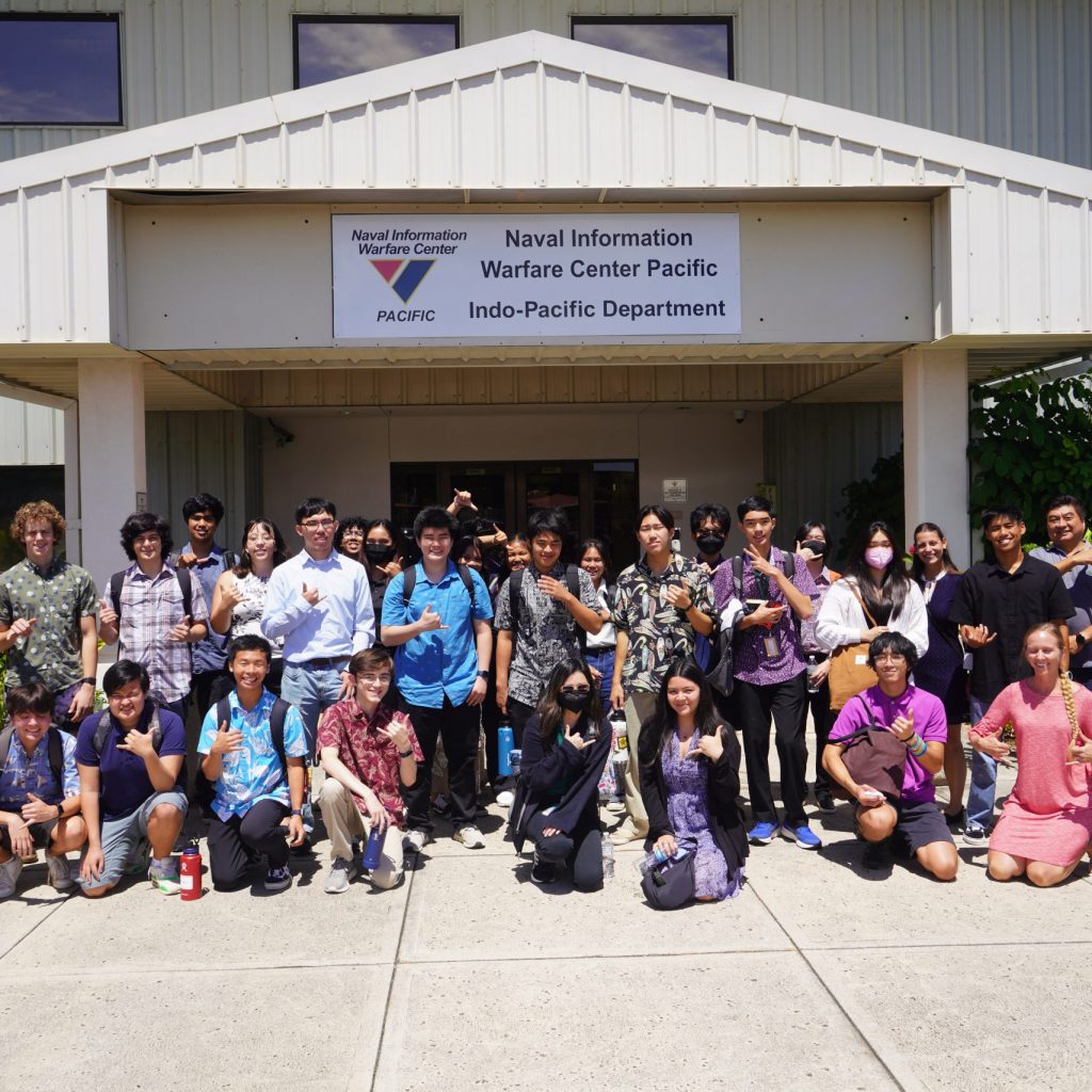 A Group Of Students Standing At Entrance Of NIWC Building