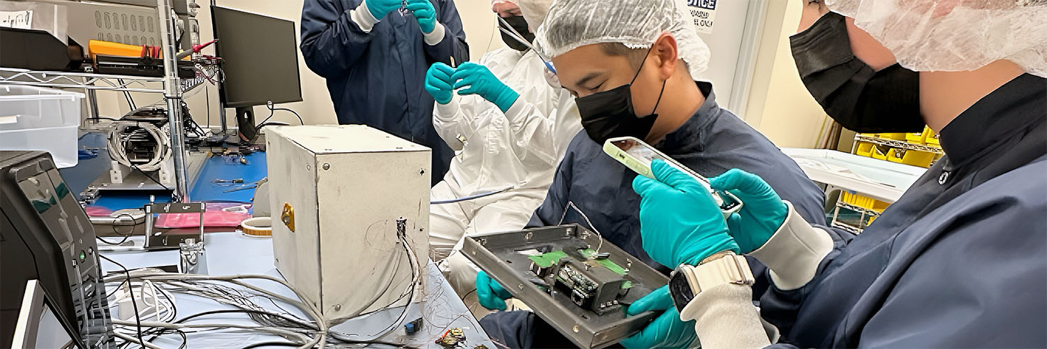 Students Working On Parts For A Missile