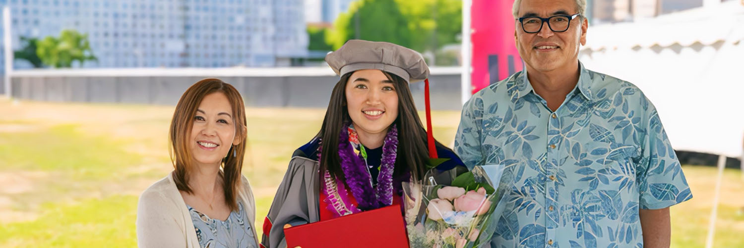 Prof. Green Posing With Her Parents At MIT Graduation Ceremony