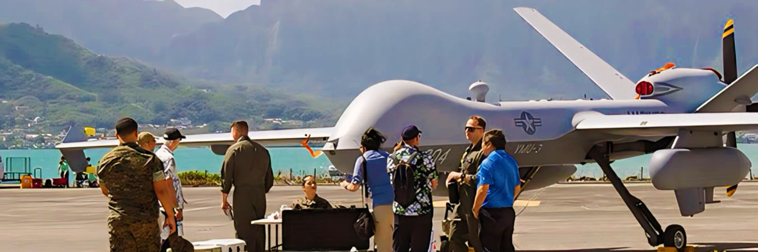 Researchers And Military Personnel Chatting In Front Of A Drone