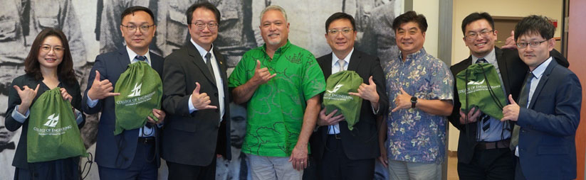 A Group Of Visiting Scholars Posing With Dean Morioka