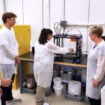 Researchers chatting in a lab