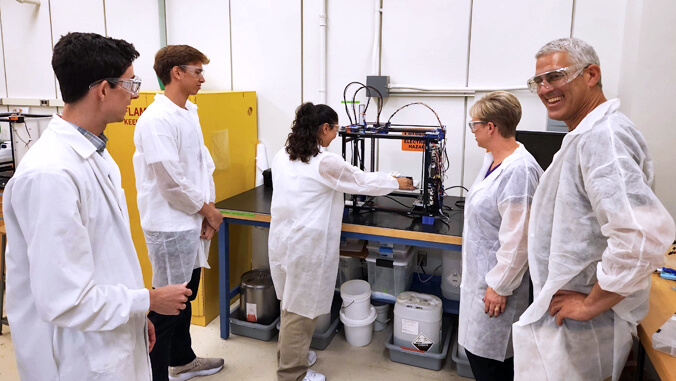 Researchers Chatting In A Lab