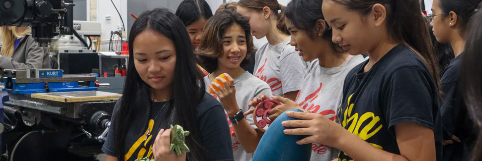 A King Intermediate 8th Grader, Holds A 3D Printed Axolotl Created In The UH College Of Engineering Machine Shop