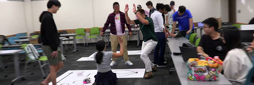 Professor Drew Celebrating With Students