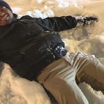 Man making a snow angel